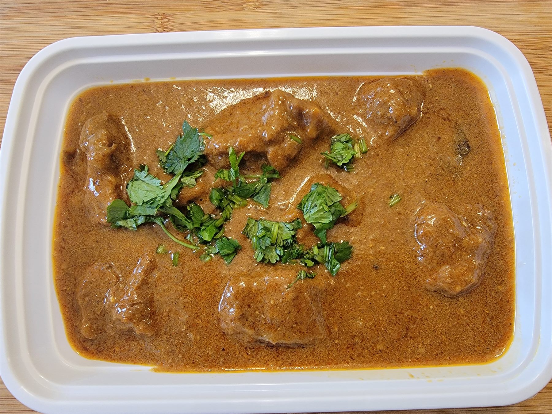 Pakistani curry in a halal catering container