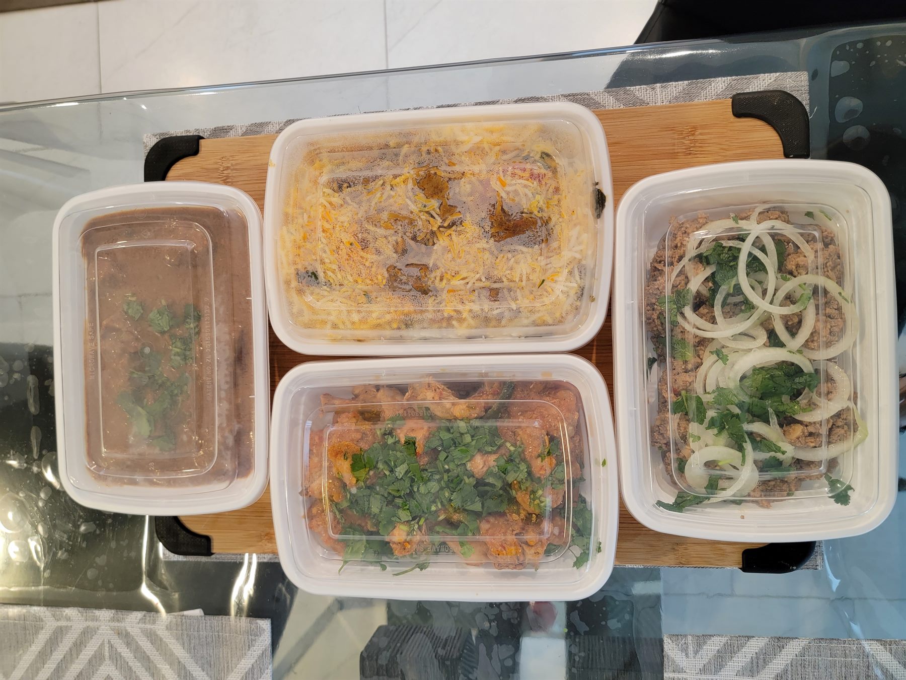 Multiple Pakistani halal catering trays for a group order